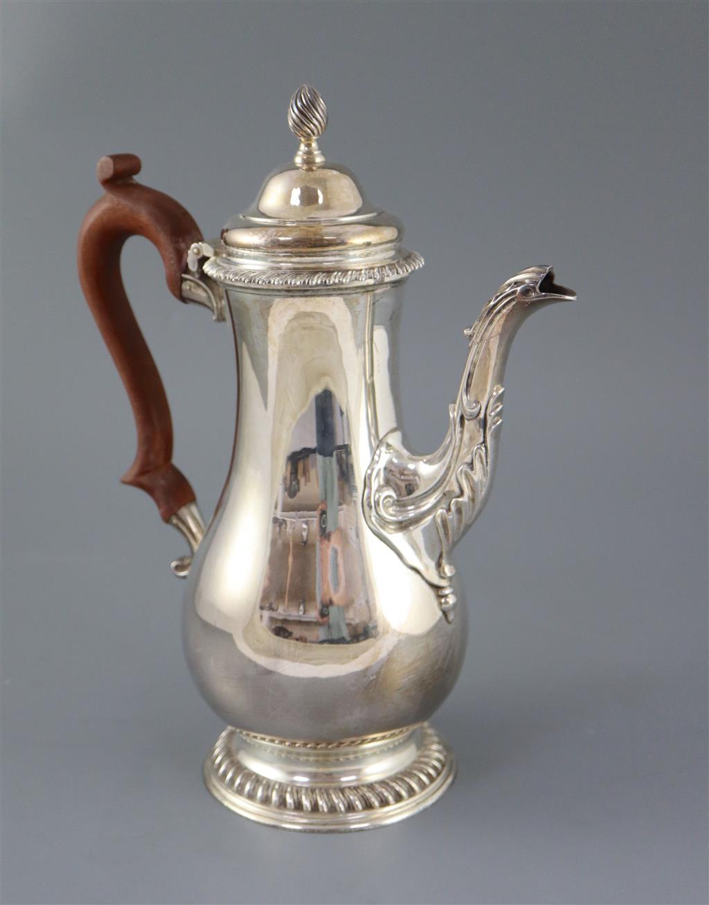 A modern 18th century style silver baluster coffee pot, by Spink & Son, gross 36oz.